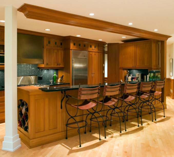 Warm wooden kitchen with bar seating, perfect for Burnaby home renovations. Kitchen renovation burnaby