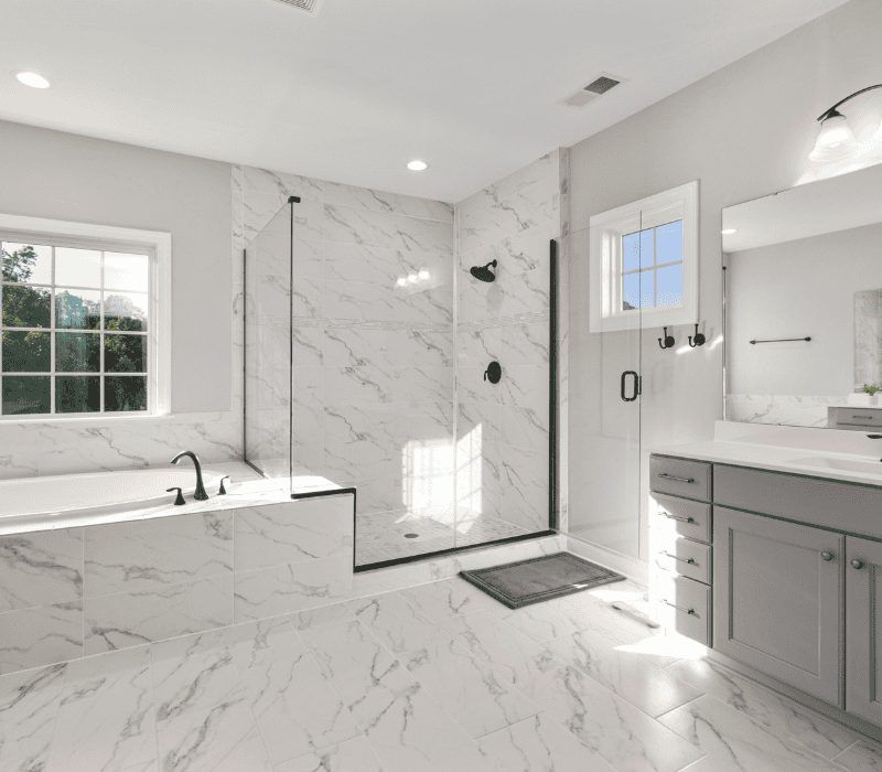 Modern bathroom with marble tiles and glass shower