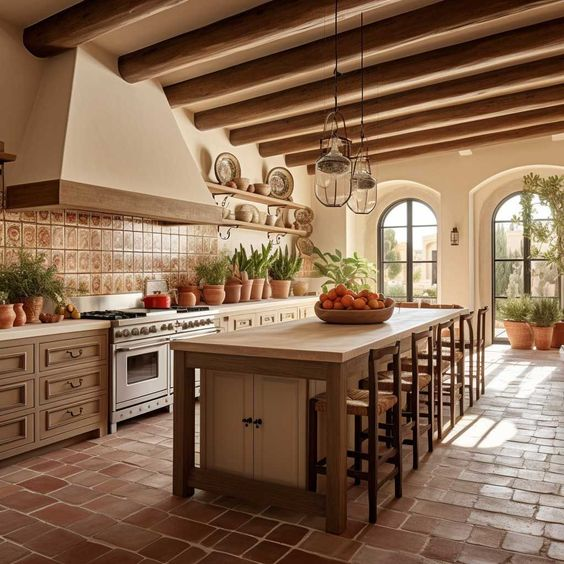 Spanish-style kitchen 2024 with terracotta tiles, wooden beams, arched windows, and rustic cabinets in warm tones.