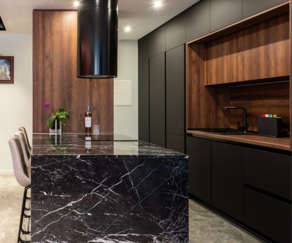 Modern kitchen featuring a luxurious black Caesarstone countertop.